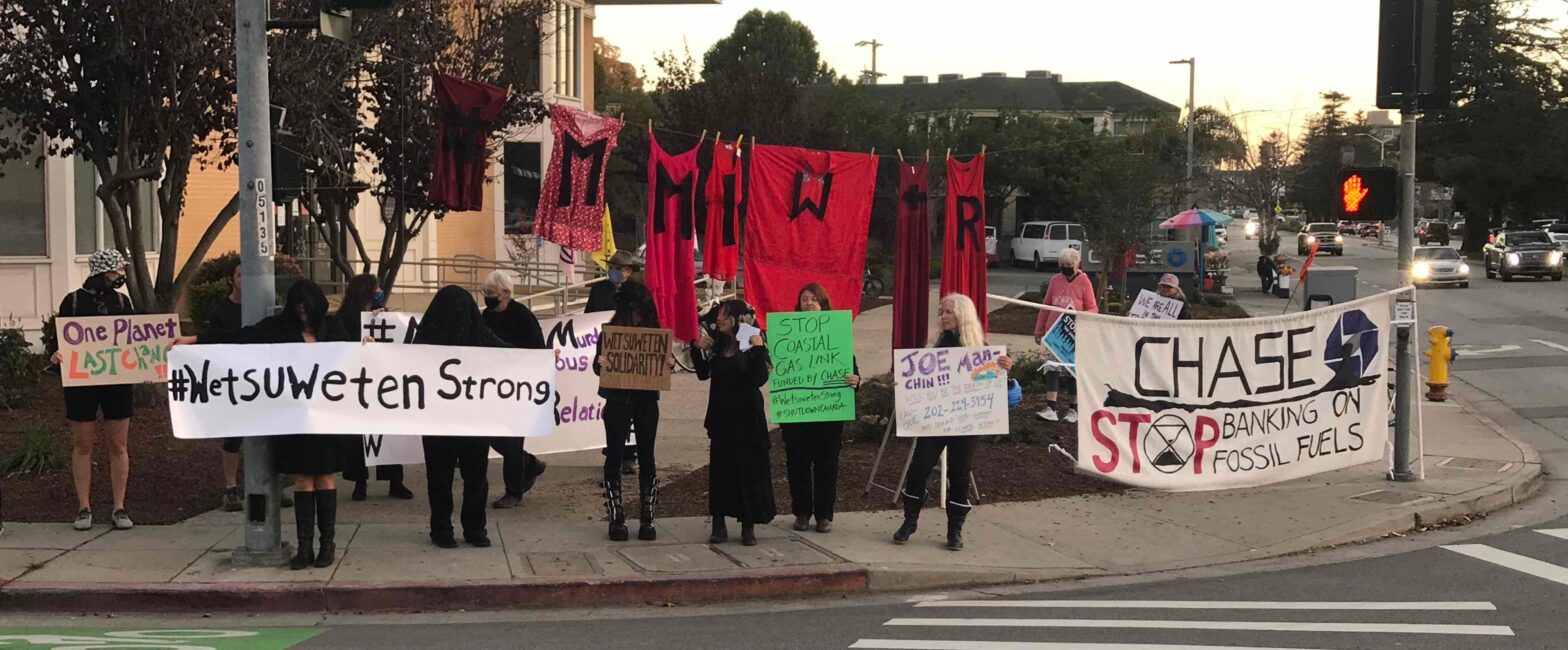 Climate Justice demonstration with red dresses for #MMIW / #MMIR, Ocean and Water St, Santa Cruz, November 26, 2021. Photo by Michael Levy.